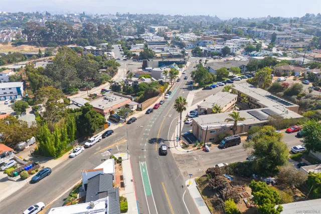 an aerial view of residential houses with outdoor space