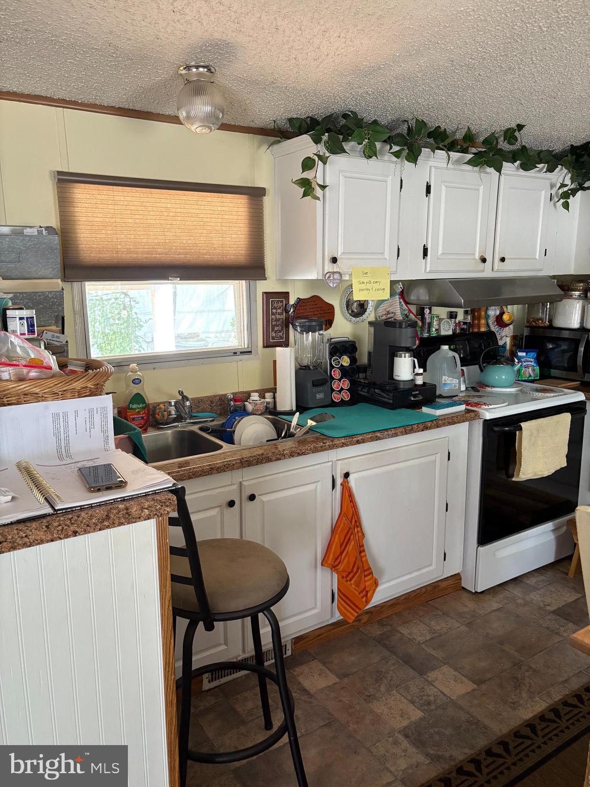 81 Spring Garden Estates Carlisle, PA 17015 - Photo 13 of 20 a kitchen with stainless steel appliances granite countertop a stove a sink and a refrigerator