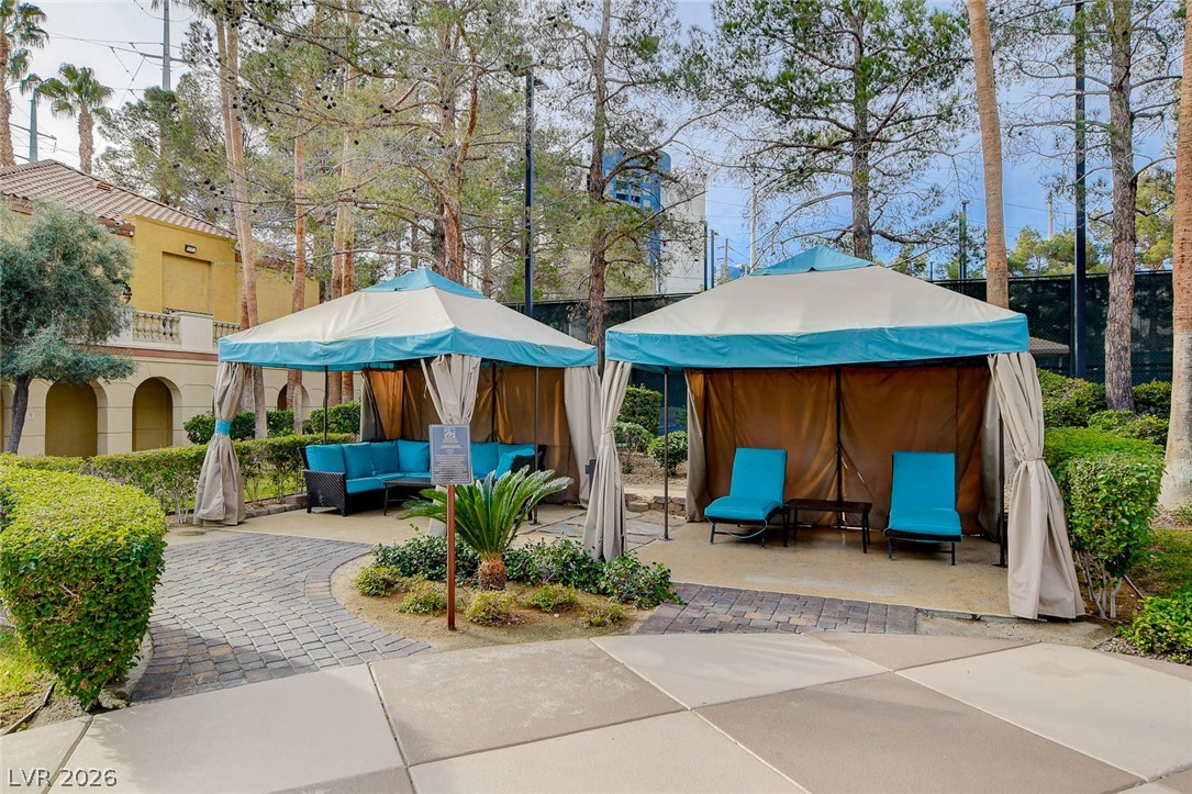 230 East Flamingo Road, Unit 106 Las Vegas, NV 89169 - Photo 48 of 66 Relax in shaded cabanas, perfect for tranquil outdoor lounging amidst lush greenery.
