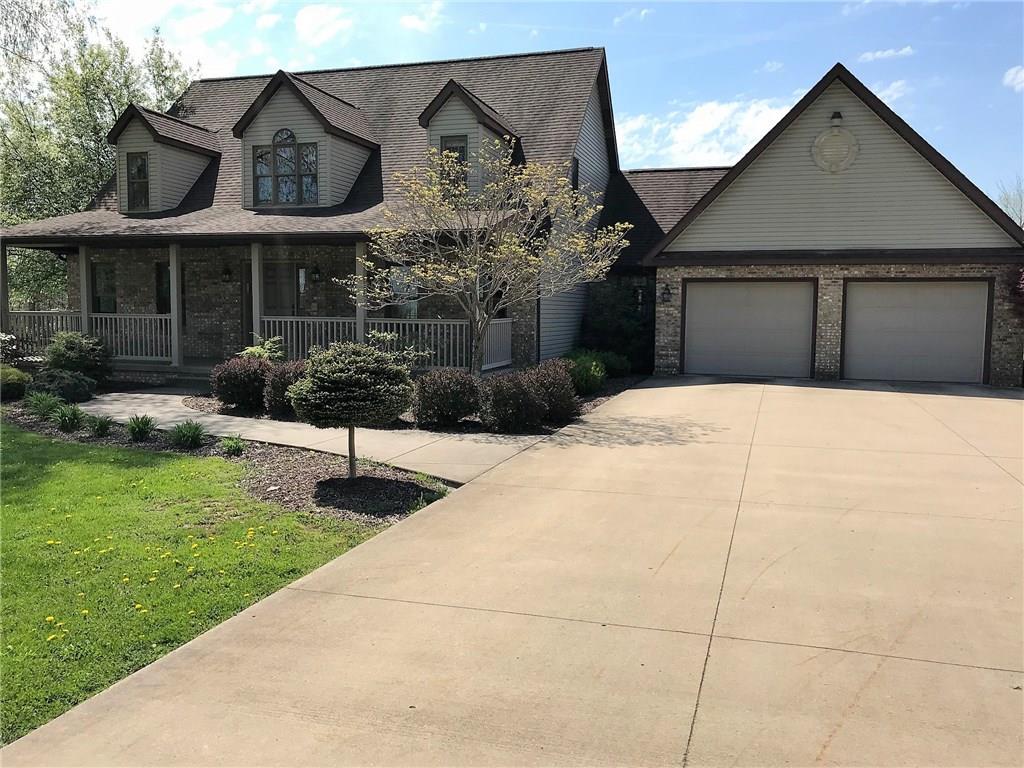 SIDE VIEW WITH CEMENTED DRIVEWAY.