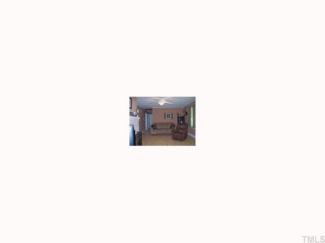 2168 Surl Mount Tirzah Road Timberlake, NC 27583 - Photo 3 of 12 a picture of a room with a white wall and a window