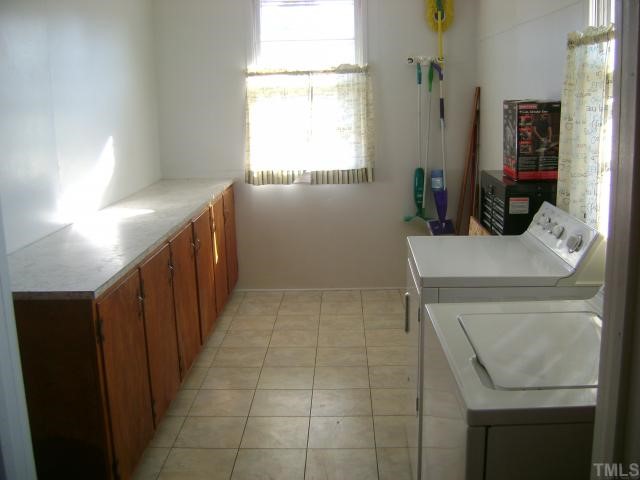 2168 Surl Mount Tirzah Road Timberlake, NC 27583 - Photo 6 of 12 a bathroom with a sink toilet and window