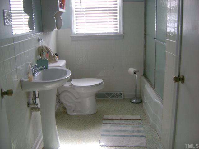 2168 Surl Mount Tirzah Road Timberlake, NC 27583 - Photo 7 of 12 a bathroom with a sink toilet and shower