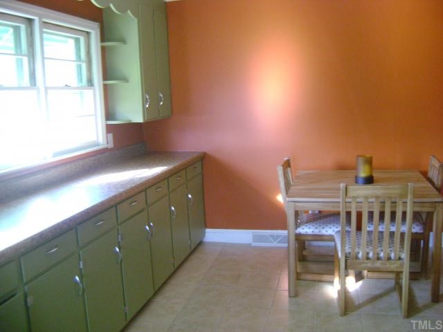 2168 Surl Mount Tirzah Road Timberlake, NC 27583 - Photo 8 of 12 a view of a workspace with furniture and a window