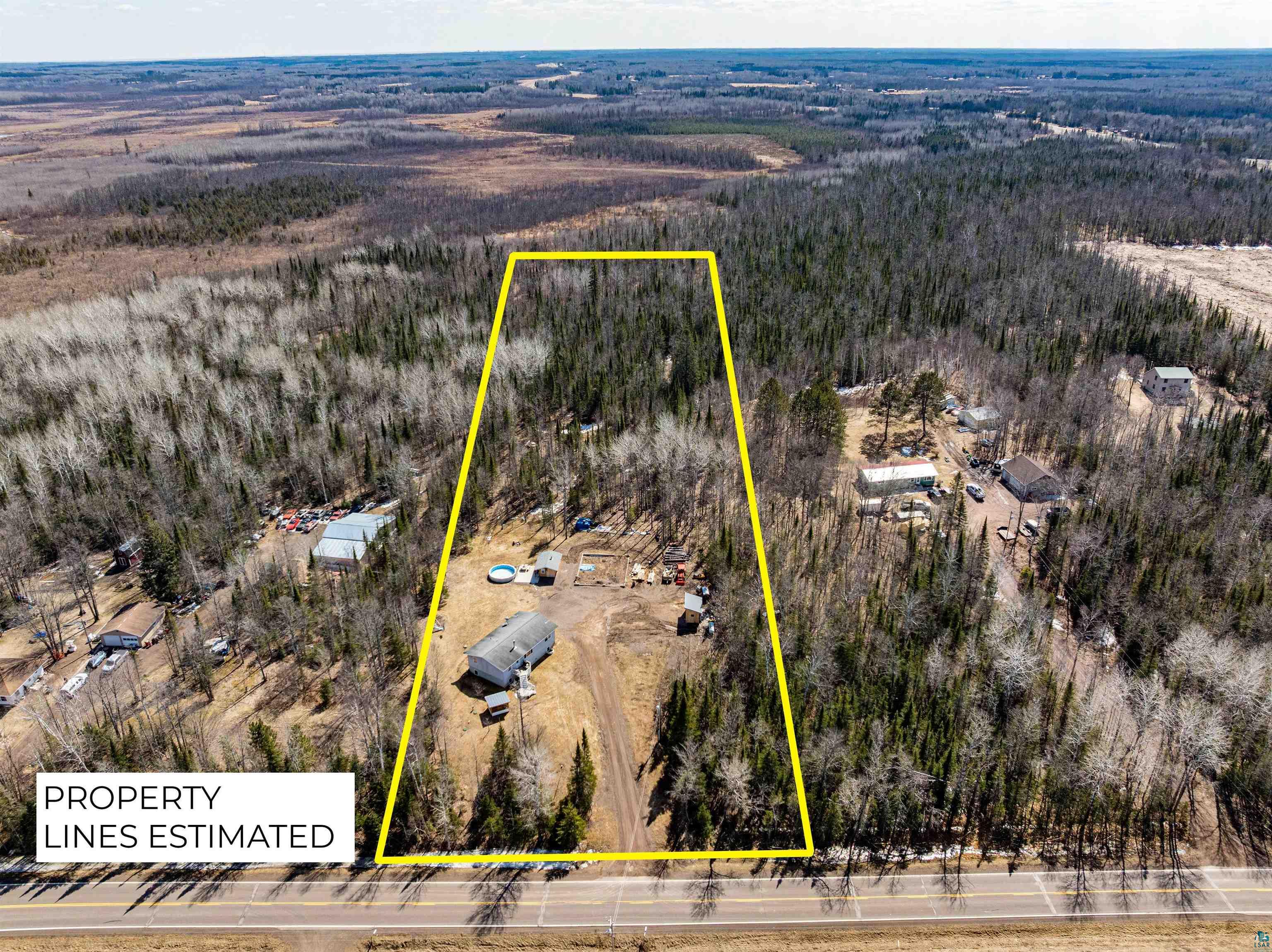 7422 Industrial Road Saginaw, MN 55779 - Photo 4 of 33 Aerial view featuring a view of trees