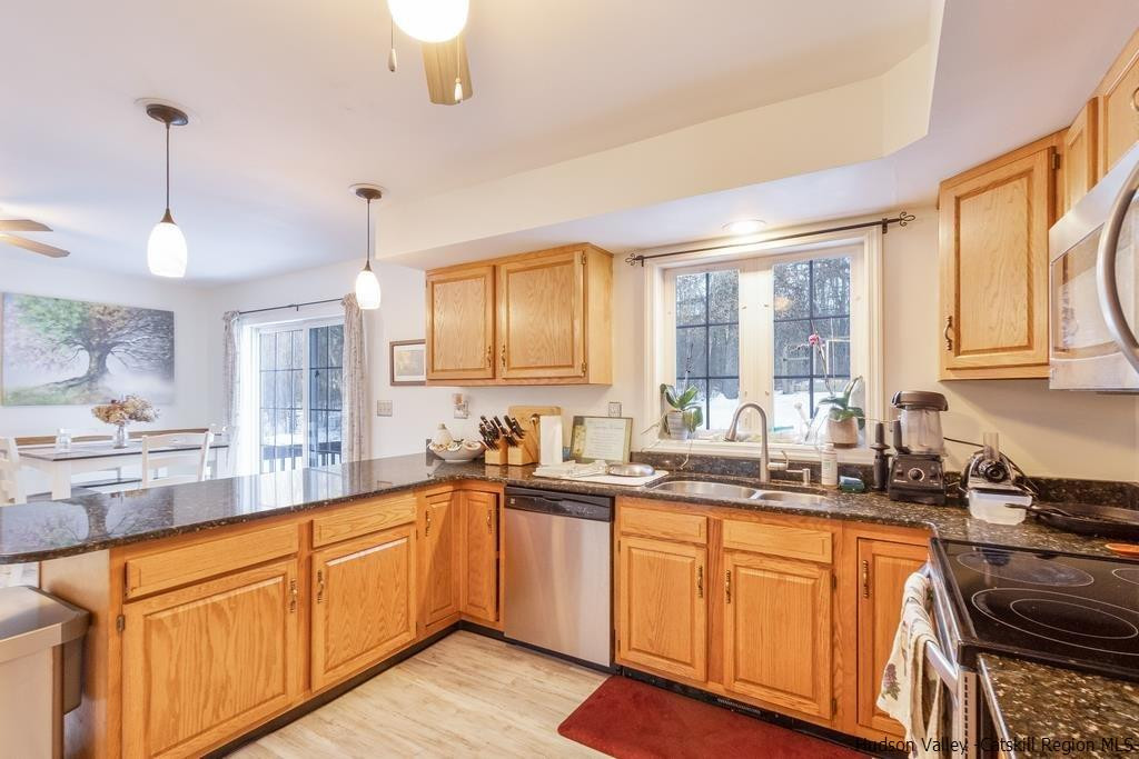13 Hasbrouck Road Wallkill, NY 12589 - Photo 12 of 34 a kitchen with sink a stove and cabinets
