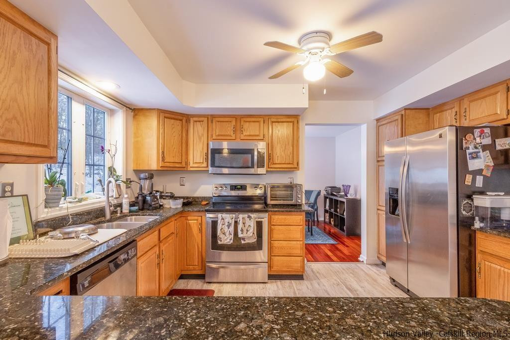 13 Hasbrouck Road Wallkill, NY 12589 - Photo 13 of 34 a kitchen with stainless steel appliances granite countertop a sink stove and refrigerator