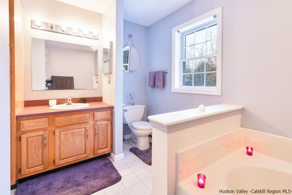 13 Hasbrouck Road Wallkill, NY 12589 - Photo 29 of 34 a bathroom with a sink vanity granite tub and a shower