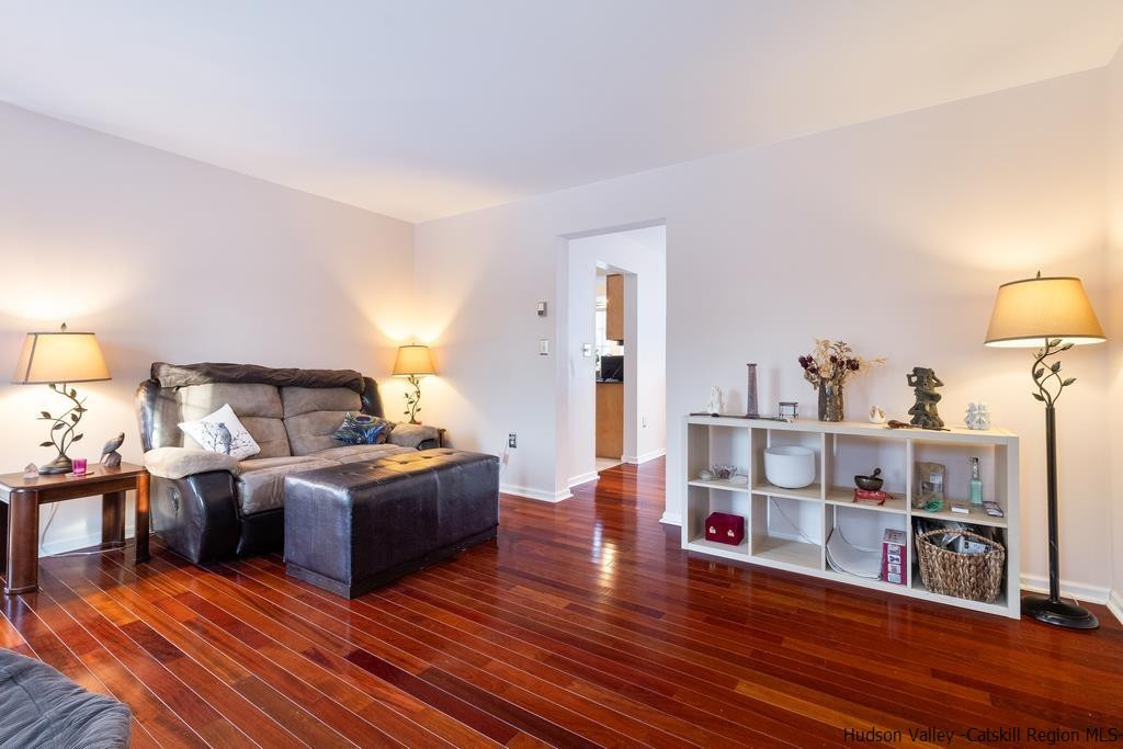 13 Hasbrouck Road Wallkill, NY 12589 - Photo 6 of 34 a living room with furniture and a wooden floor