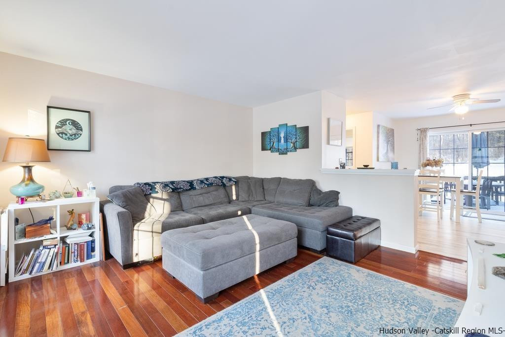 13 Hasbrouck Road Wallkill, NY 12589 - Photo 8 of 34 a living room with furniture and a table