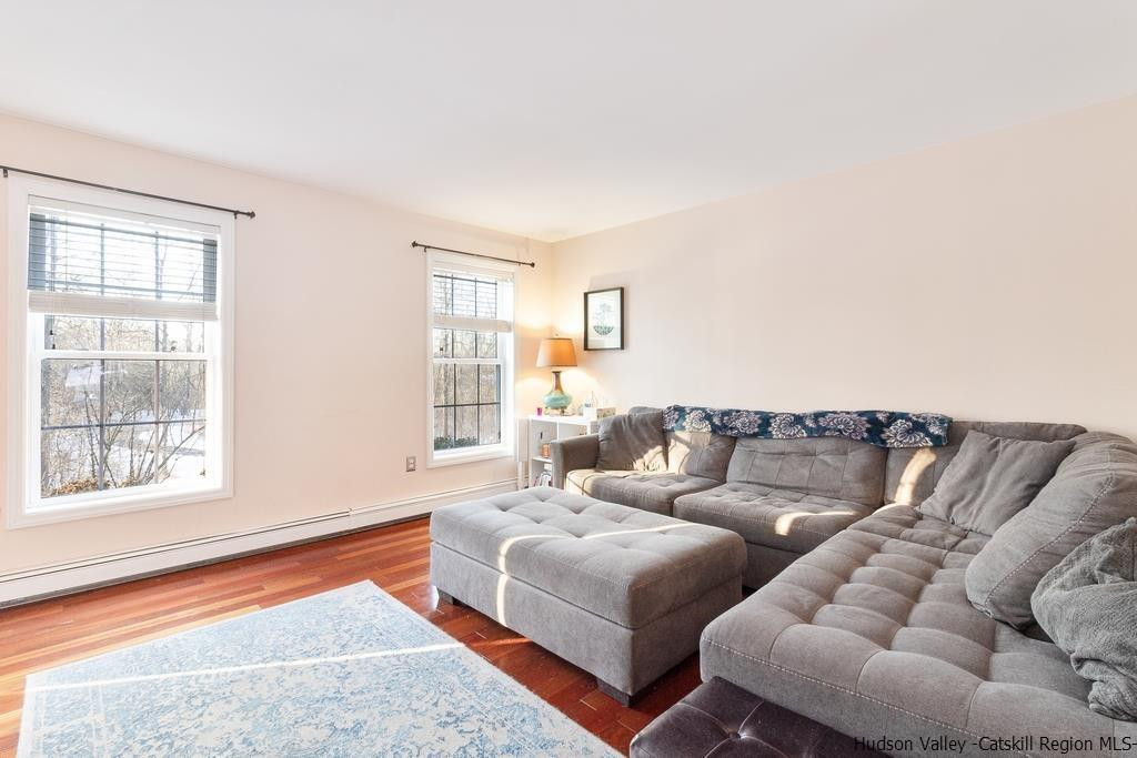 13 Hasbrouck Road Wallkill, NY 12589 - Photo 9 of 34 a living room with furniture and a window
