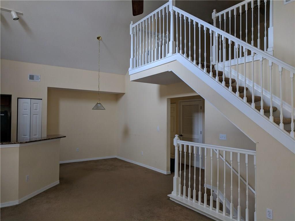 1645 Southeast Pomeroy Street, Unit 42 Stuart, FL 34997 - Photo 14 of 29 a view of staircase with railing and white walls