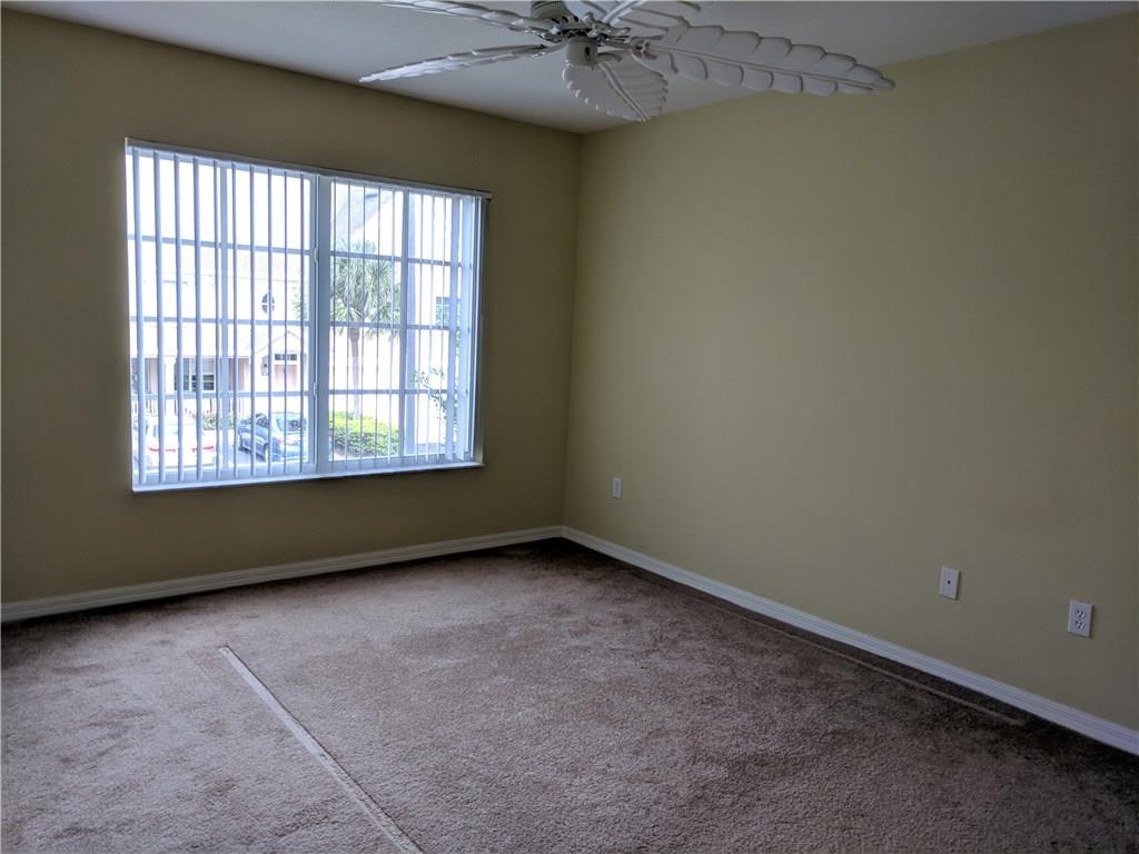 1645 Southeast Pomeroy Street, Unit 42 Stuart, FL 34997 - Photo 21 of 29 an empty room with a window
