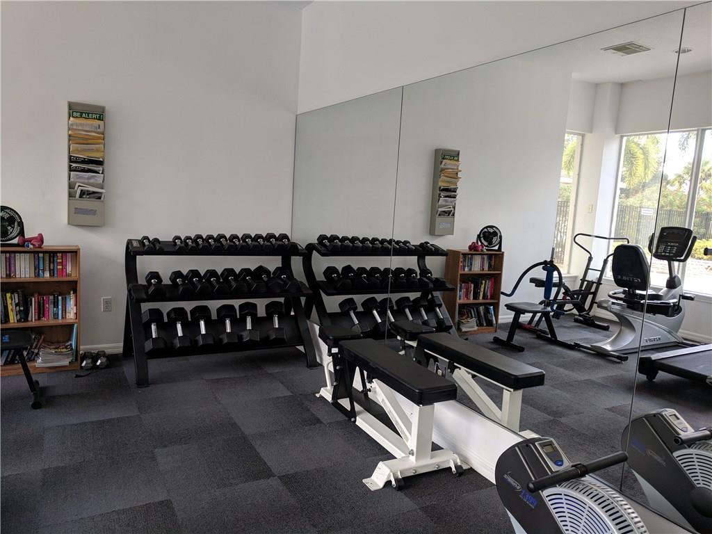 1645 Southeast Pomeroy Street, Unit 42 Stuart, FL 34997 - Photo 27 of 29 a view of a room with gym equipment