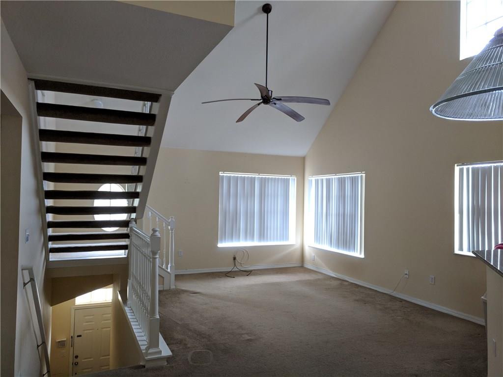 1645 Southeast Pomeroy Street, Unit 42 Stuart, FL 34997 - Photo 5 of 29 a view of an empty room with a window