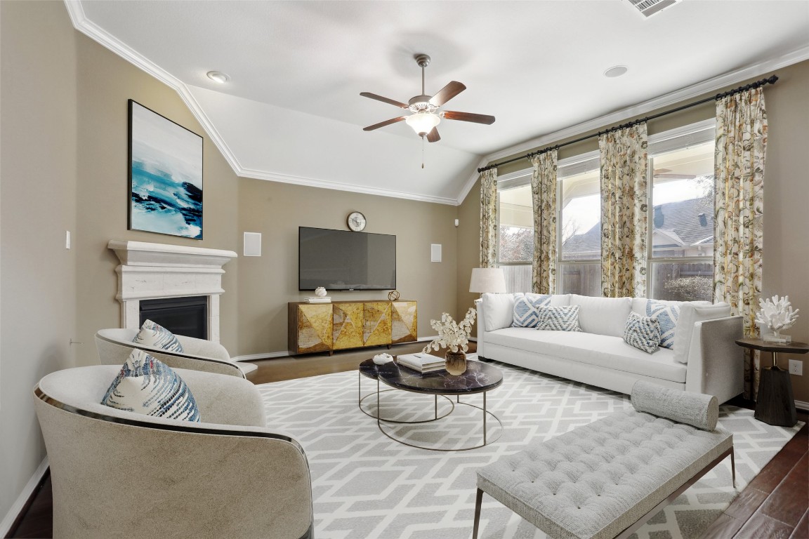 3205 Mayfield Ranch Cove Round Rock, TX 78681 - Photo 1 of 1 a living room with fireplace furniture and a large window