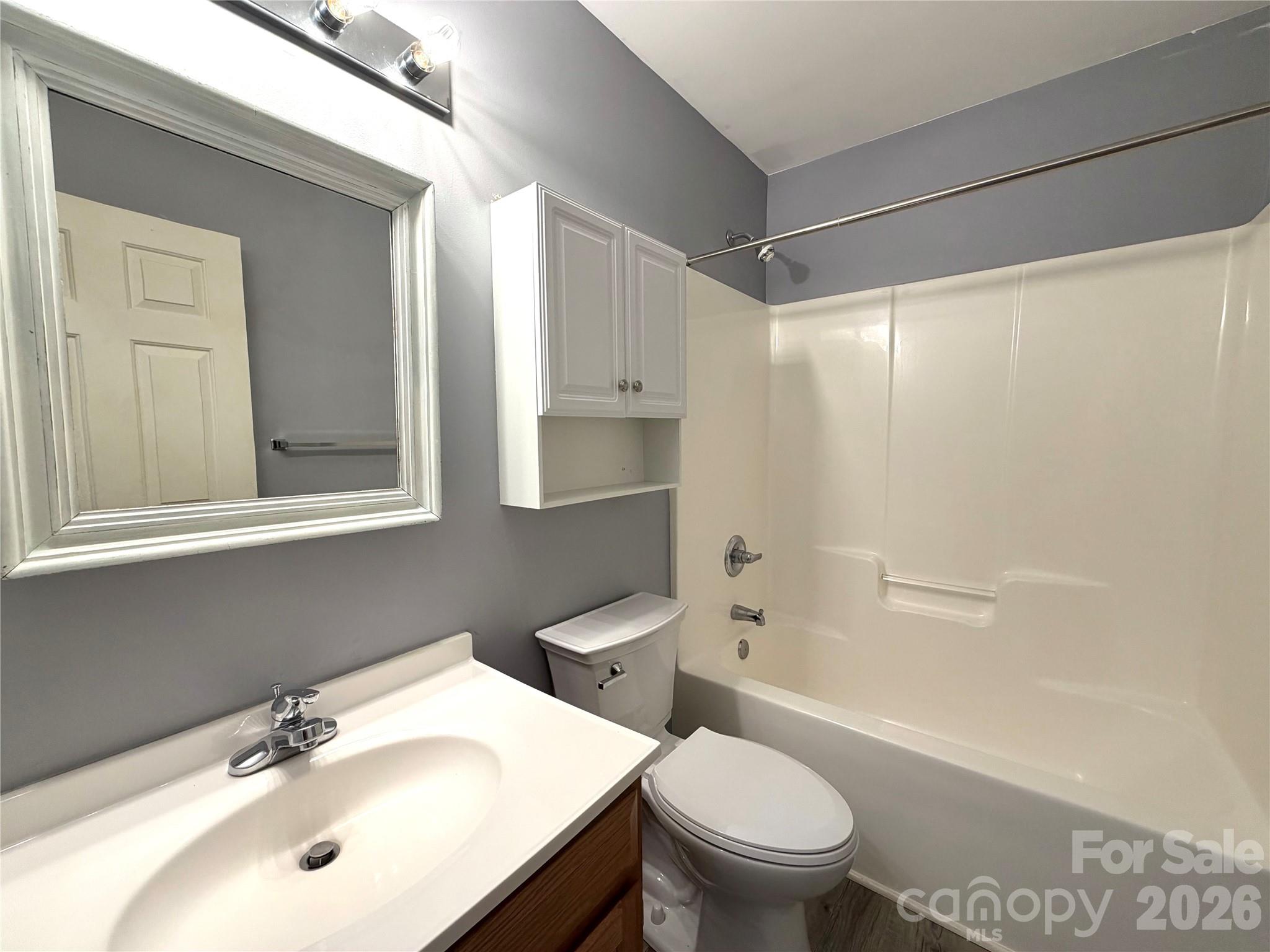 1027 Tabor Road Olin, NC 28660 - Photo 26 of 43 a bathroom with a sink toilet and shower