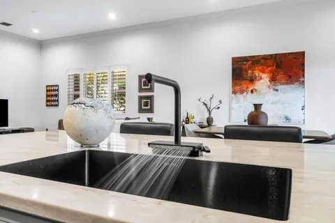 a view of an empty room with windows