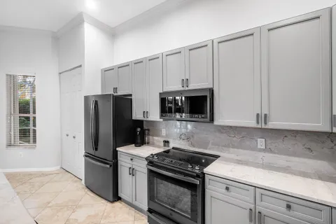 a living room with furniture and a dining table