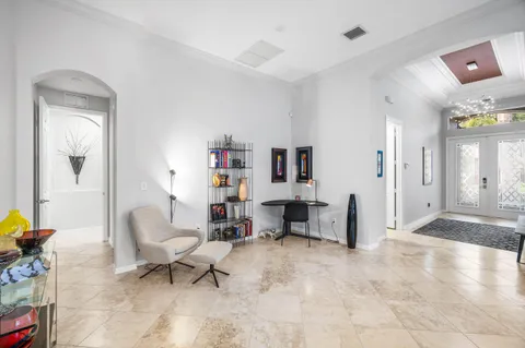 a bathroom with a tub a sink double vanity and a mirror