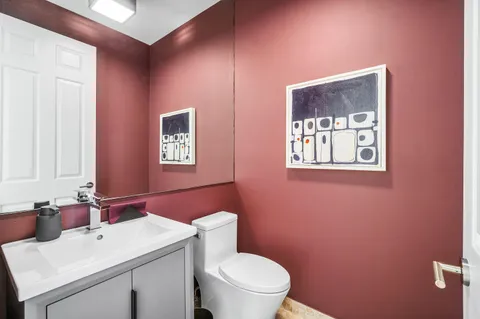 a bathroom with a tub sink shower and mirror