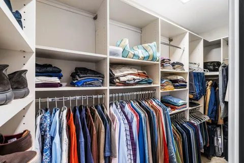 a view of washer and dryer with kitchen in the background