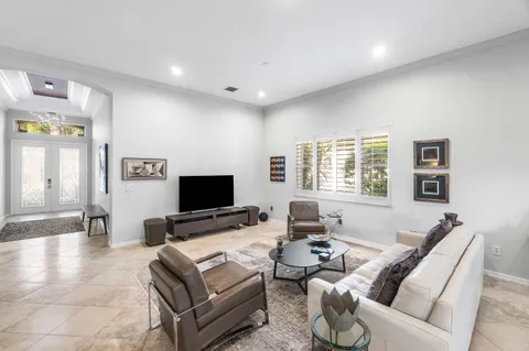 a kitchen with granite countertop white cabinets and stainless steel appliances