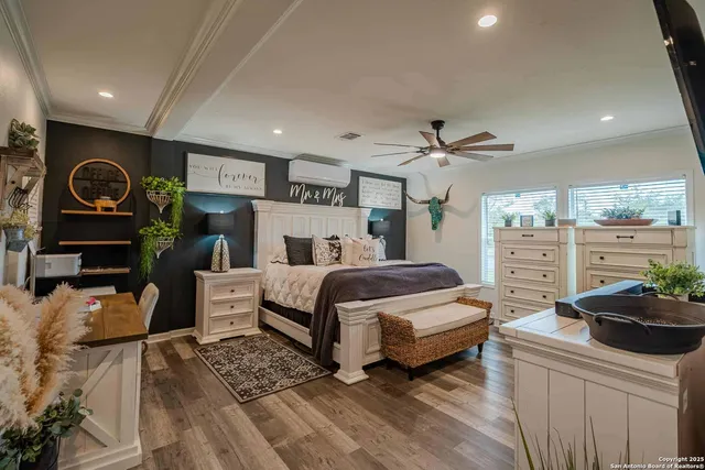 a bedroom with a bed and a dresser