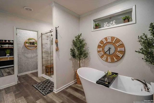 a bathroom with a sink a mirror and a shower