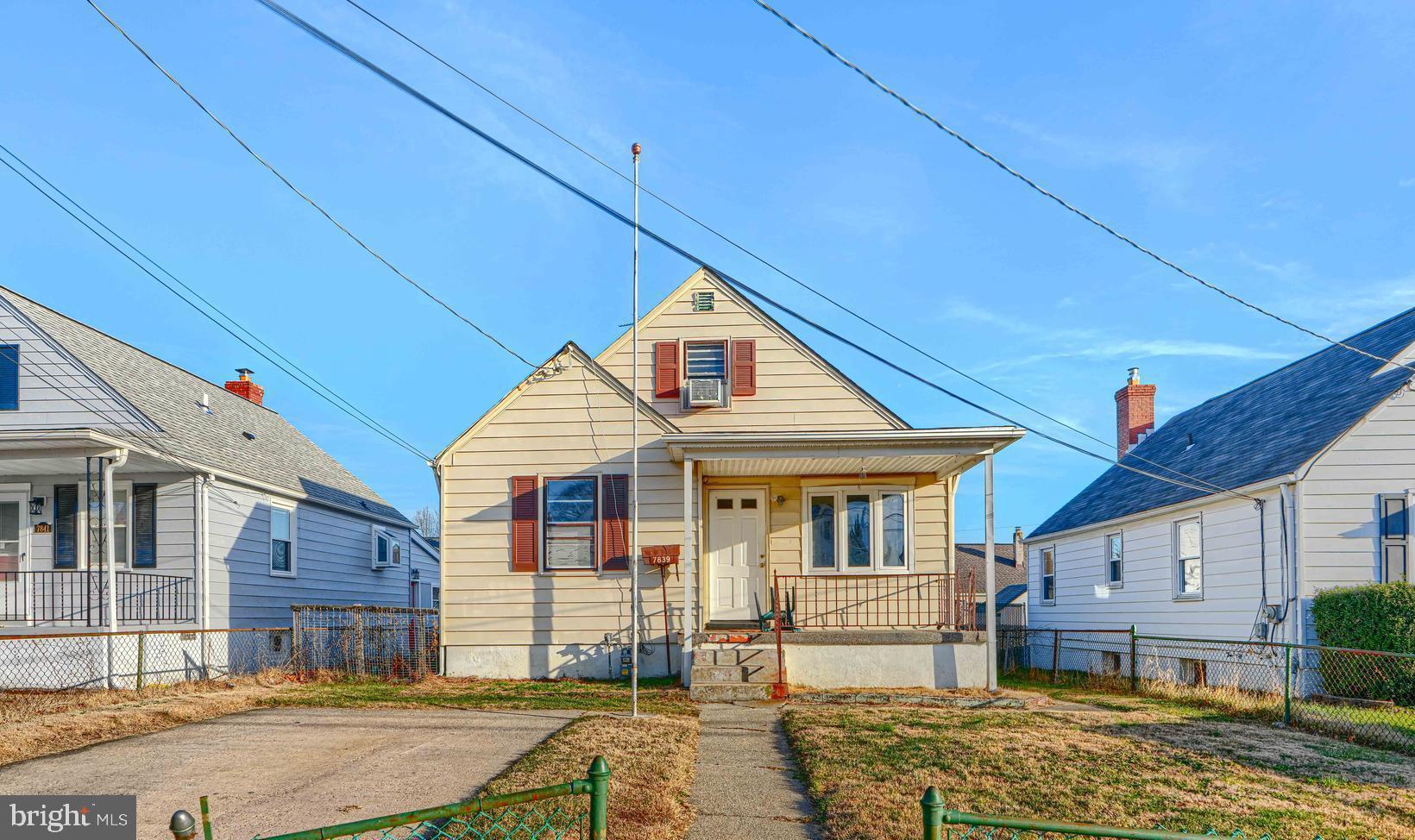 7839 Birmingham Avenue Baltimore, MD 21234 - Photo 1 of 24 a front view of a house with a yard