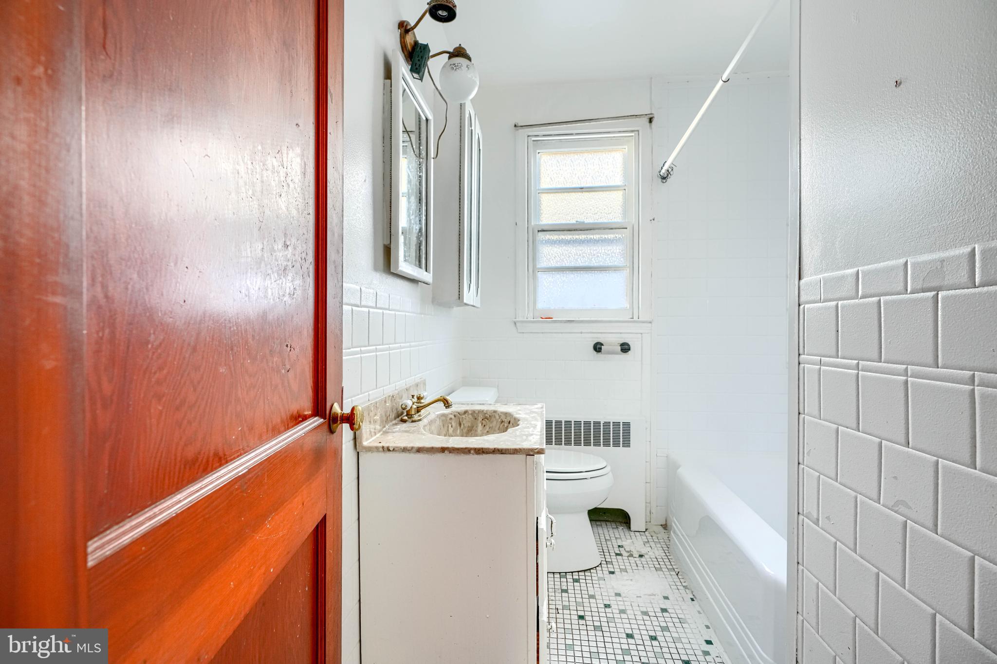 7839 Birmingham Avenue Baltimore, MD 21234 - Photo 14 of 24 a bathroom with a sink and a shower
