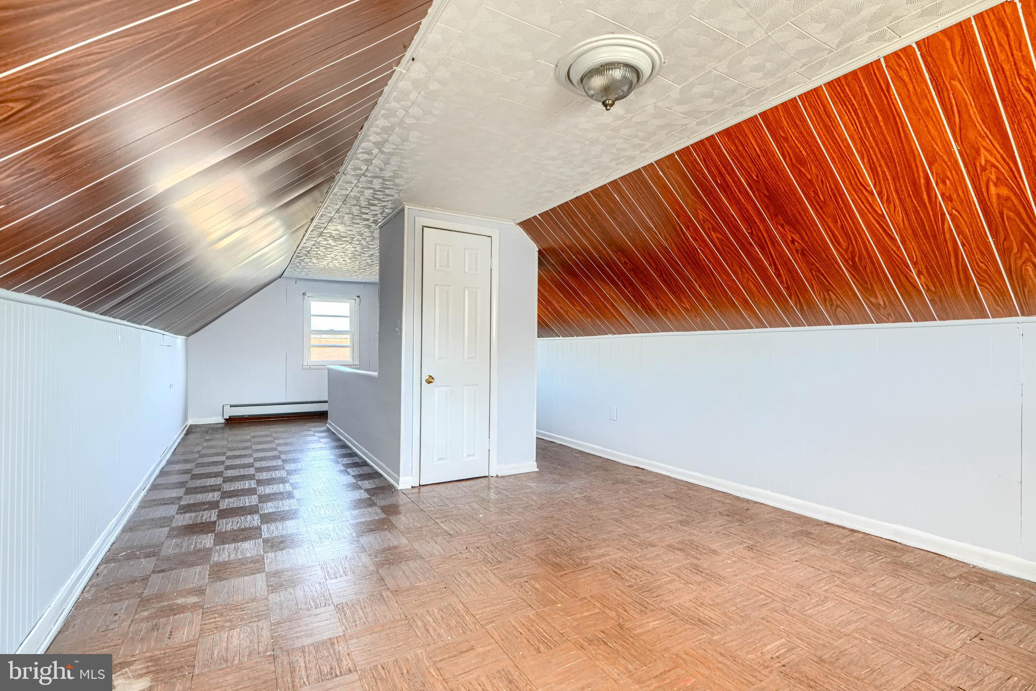 7839 Birmingham Avenue Baltimore, MD 21234 - Photo 18 of 24 a view of an empty room with wooden floor