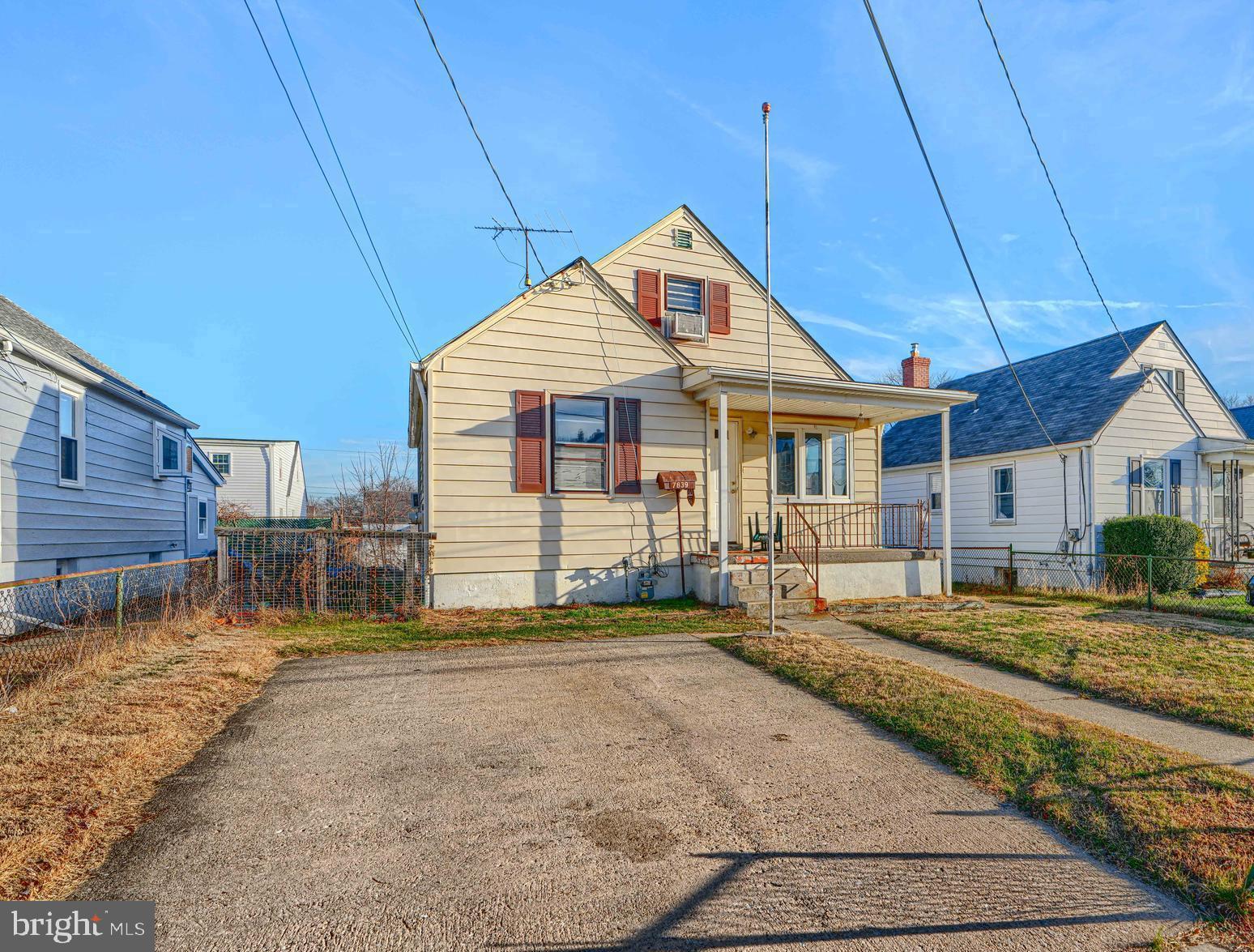 7839 Birmingham Avenue Baltimore, MD 21234 - Photo 2 of 24 a front view of a house with a yard