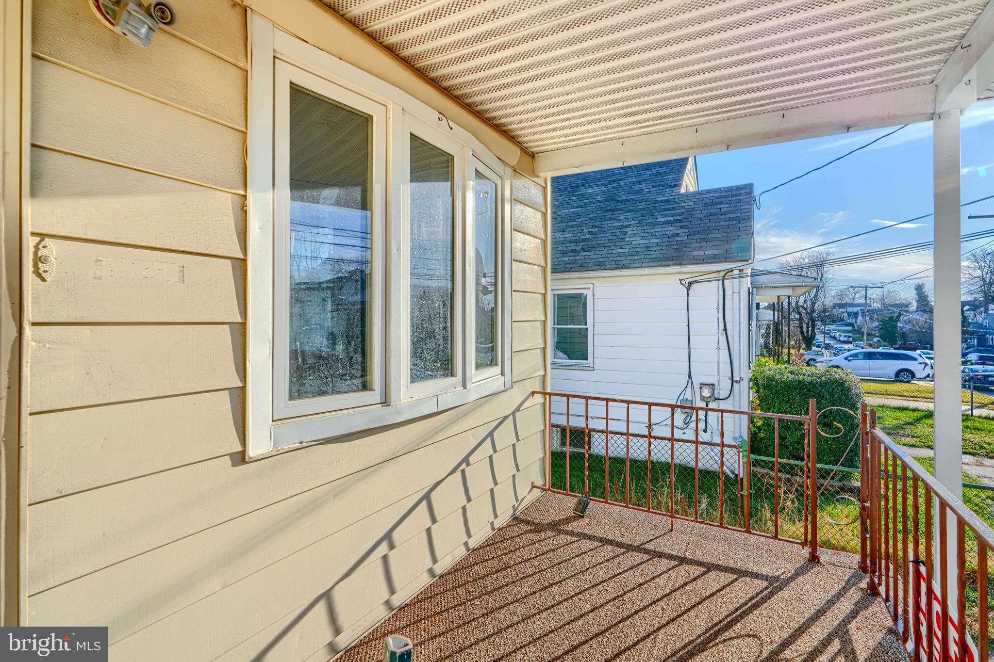 7839 Birmingham Avenue Baltimore, MD 21234 - Photo 5 of 24 a view of a balcony with wooden floor