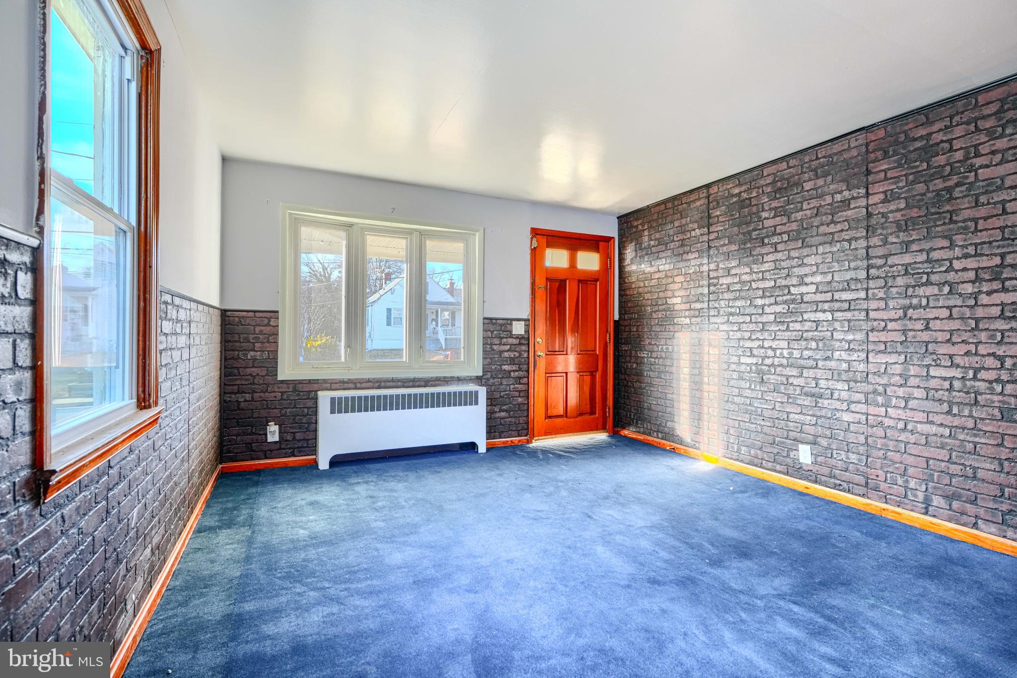 7839 Birmingham Avenue Baltimore, MD 21234 - Photo 7 of 24 a view of an empty room with glass door