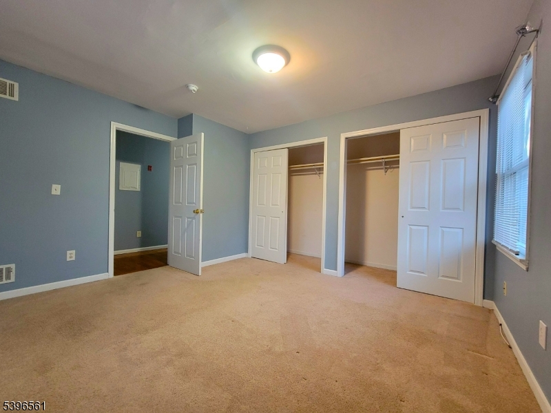 272 Us Highway, Unit C Andover, NJ 07821 - Photo 4 of 27 an empty room with closet and wooden floor