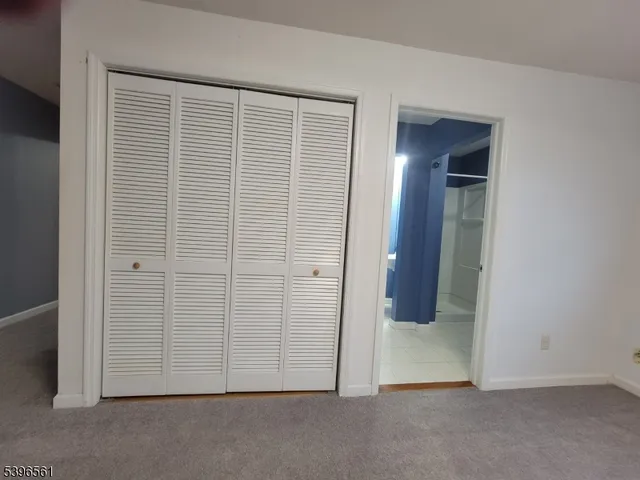 an empty room with wooden door