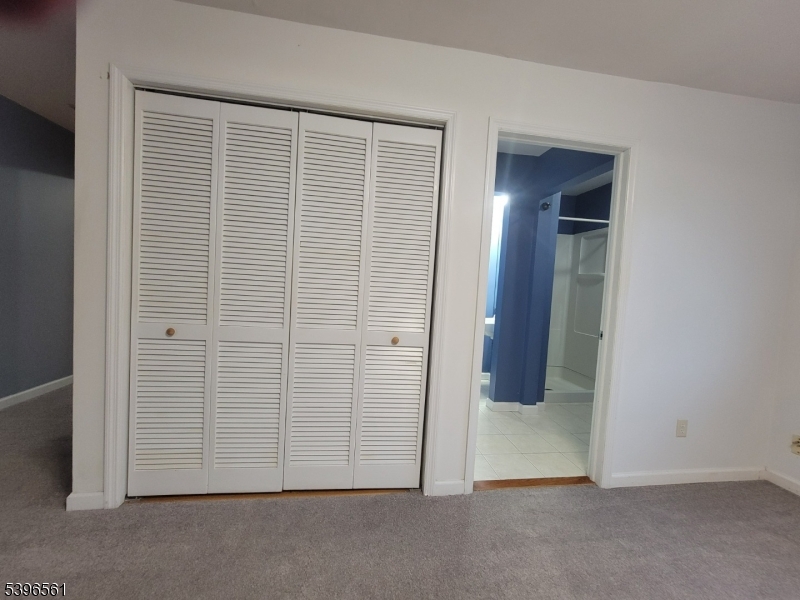272 Us Highway, Unit C Andover, NJ 07821 - Photo 7 of 27 an empty room with wooden door
