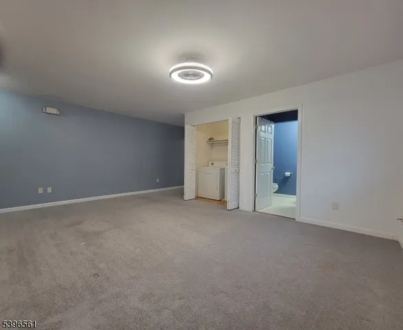 an empty room with closet area