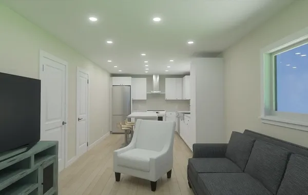 a hallway with front door wooden floor and windows