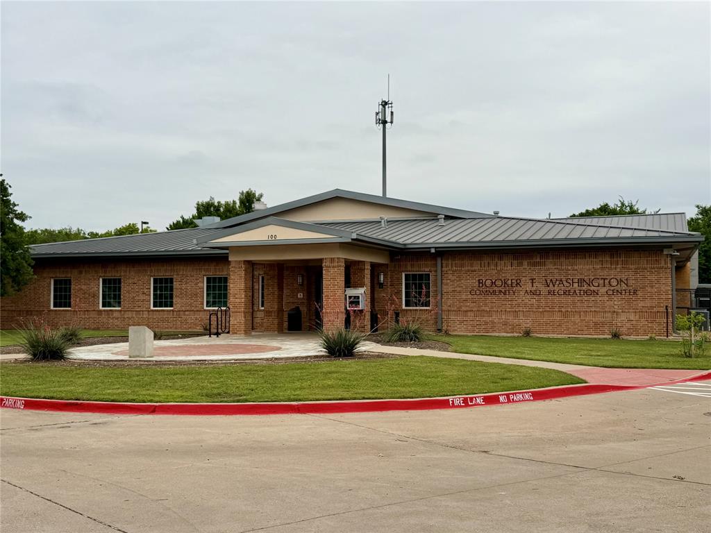 619 Mansfield Road Cleburne, TX 76031 - Photo 16 of 19 Booker T Recreation Center located less than a half mile away! Brick building with a metal roof and a prominent covered entryway