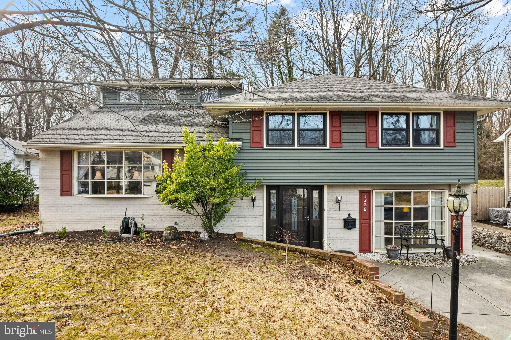 1228 Chesterfield Road Haddonfield, NJ 08033 - Photo 2 of 46 a front view of a house with garden