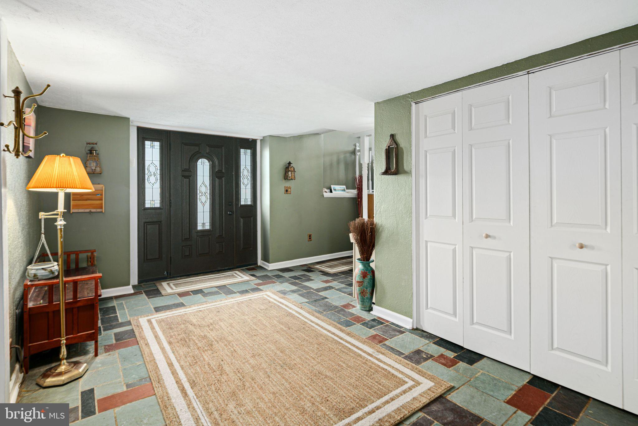 1228 Chesterfield Road Haddonfield, NJ 08033 - Photo 5 of 46 a living room with a couch and a table in it
