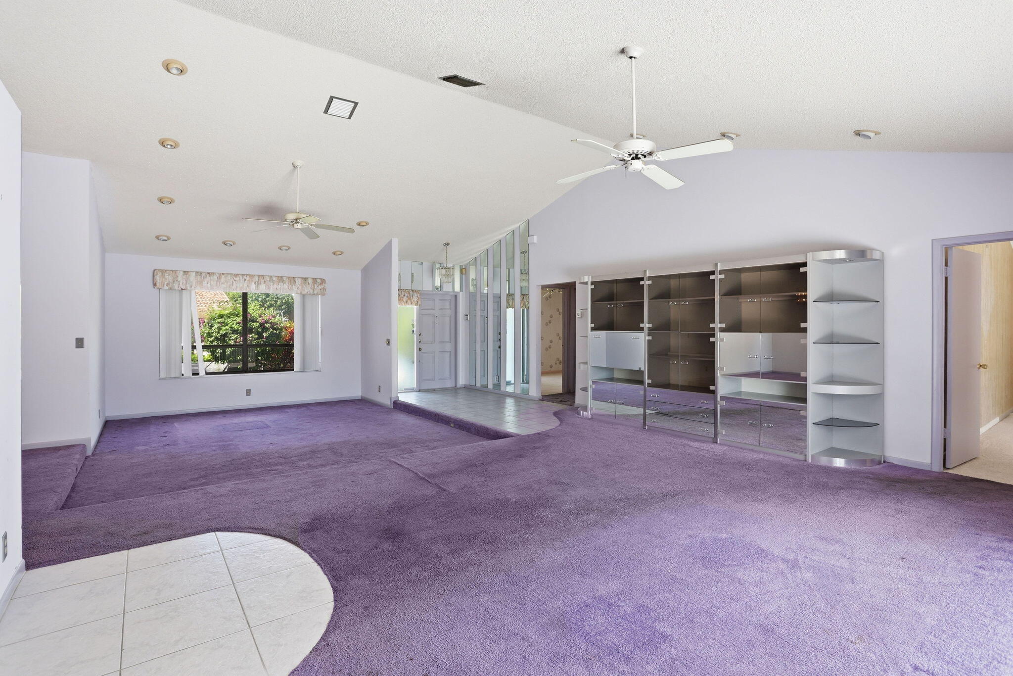9476 El Clair Ranch Road Boynton Beach, FL 33437 - Photo 11 of 29 a view of a livingroom with an empty space and a ceiling fan