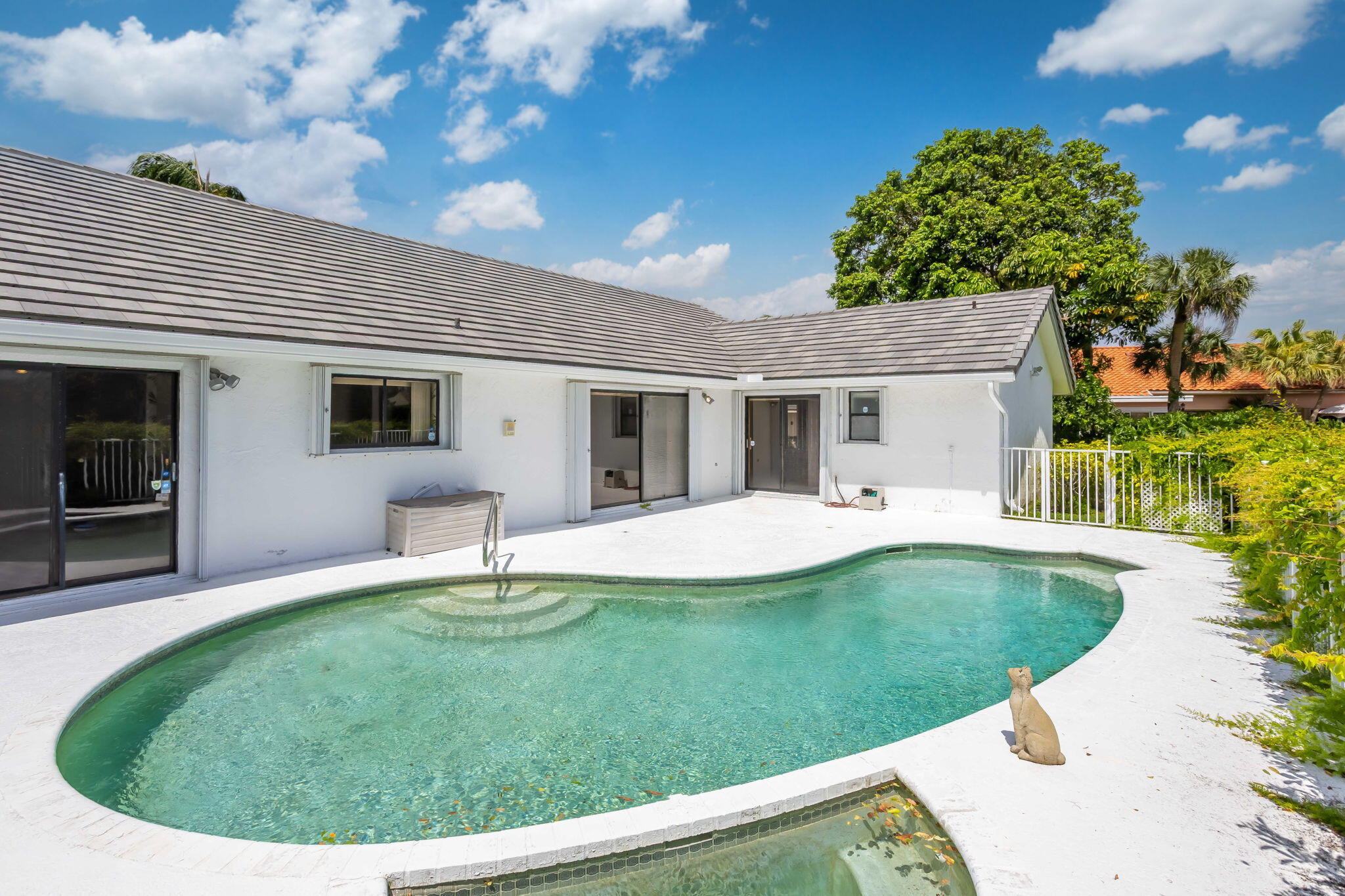 9476 El Clair Ranch Road Boynton Beach, FL 33437 - Photo 18 of 29 a view of a house with a backyard porch and sitting area