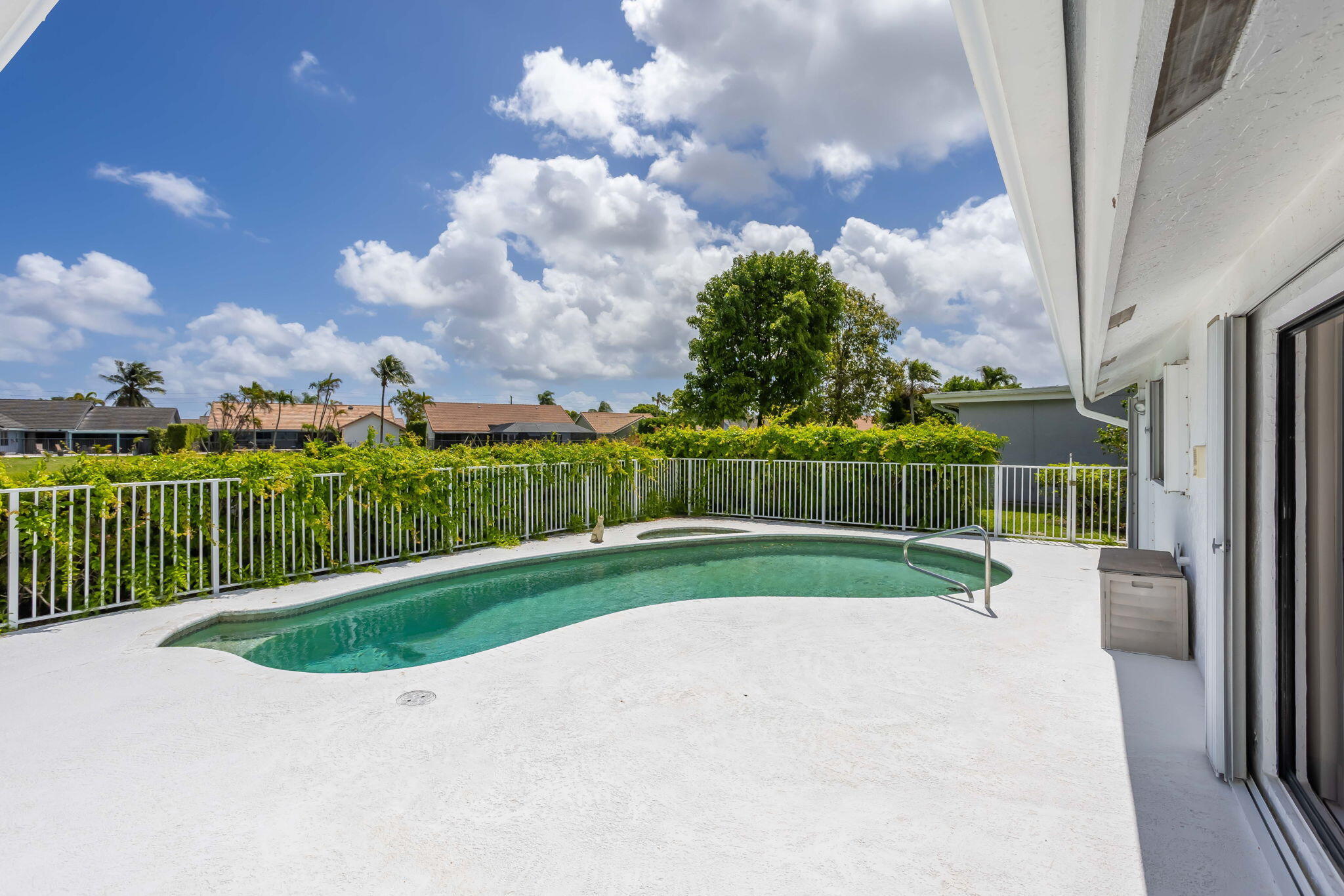 9476 El Clair Ranch Road Boynton Beach, FL 33437 - Photo 19 of 29 a view of a porch with a yard