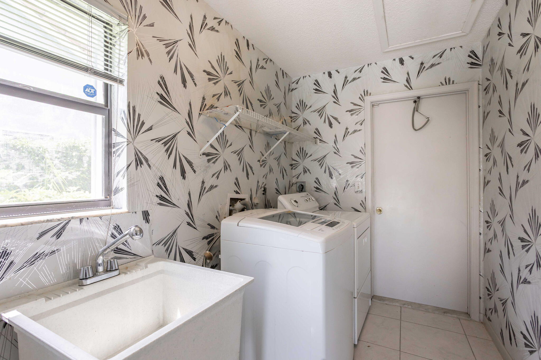 9476 El Clair Ranch Road Boynton Beach, FL 33437 - Photo 20 of 29 a bathroom with a sink and mirror with toilet