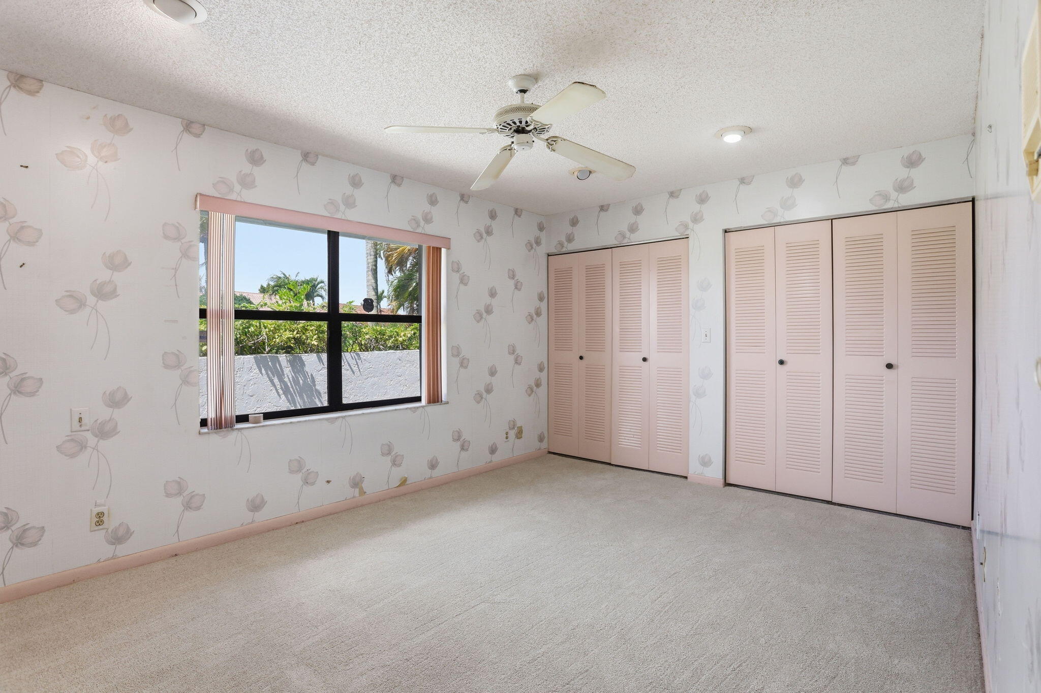 9476 El Clair Ranch Road Boynton Beach, FL 33437 - Photo 25 of 29 an empty room with windows and closet