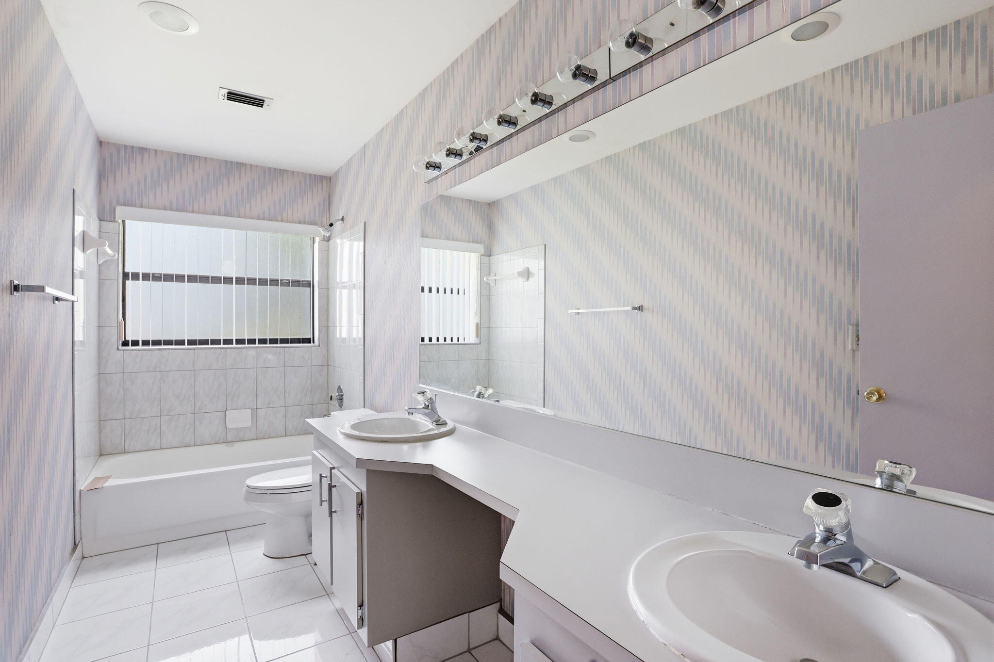 9476 El Clair Ranch Road Boynton Beach, FL 33437 - Photo 27 of 29 a bathroom with a sink a toilet and shower
