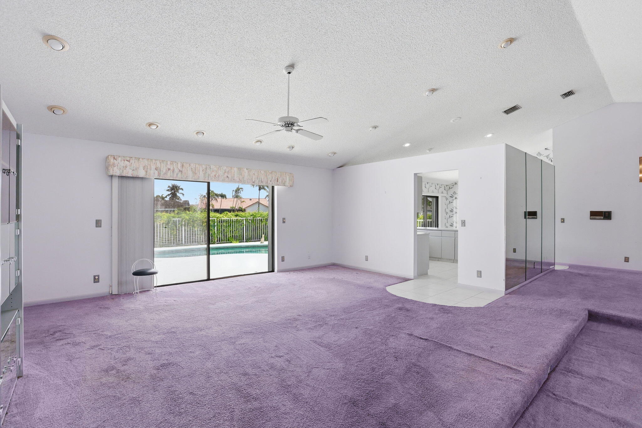 9476 El Clair Ranch Road Boynton Beach, FL 33437 - Photo 9 of 29 a view of an empty room with a windows and cabinet